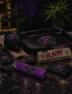 Rolling tray, RAW papers, grinder and lighter on dark marble