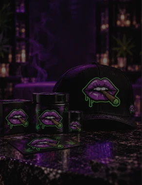 Much Love branded cap, jars and box on a dark marble bar