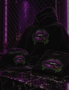 Much Love hoodie, cap and tee under purple light