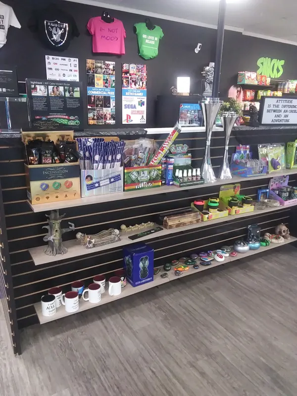 Shelves of incense, mugs, novelty gifts and custom T-shirts at Much Love
